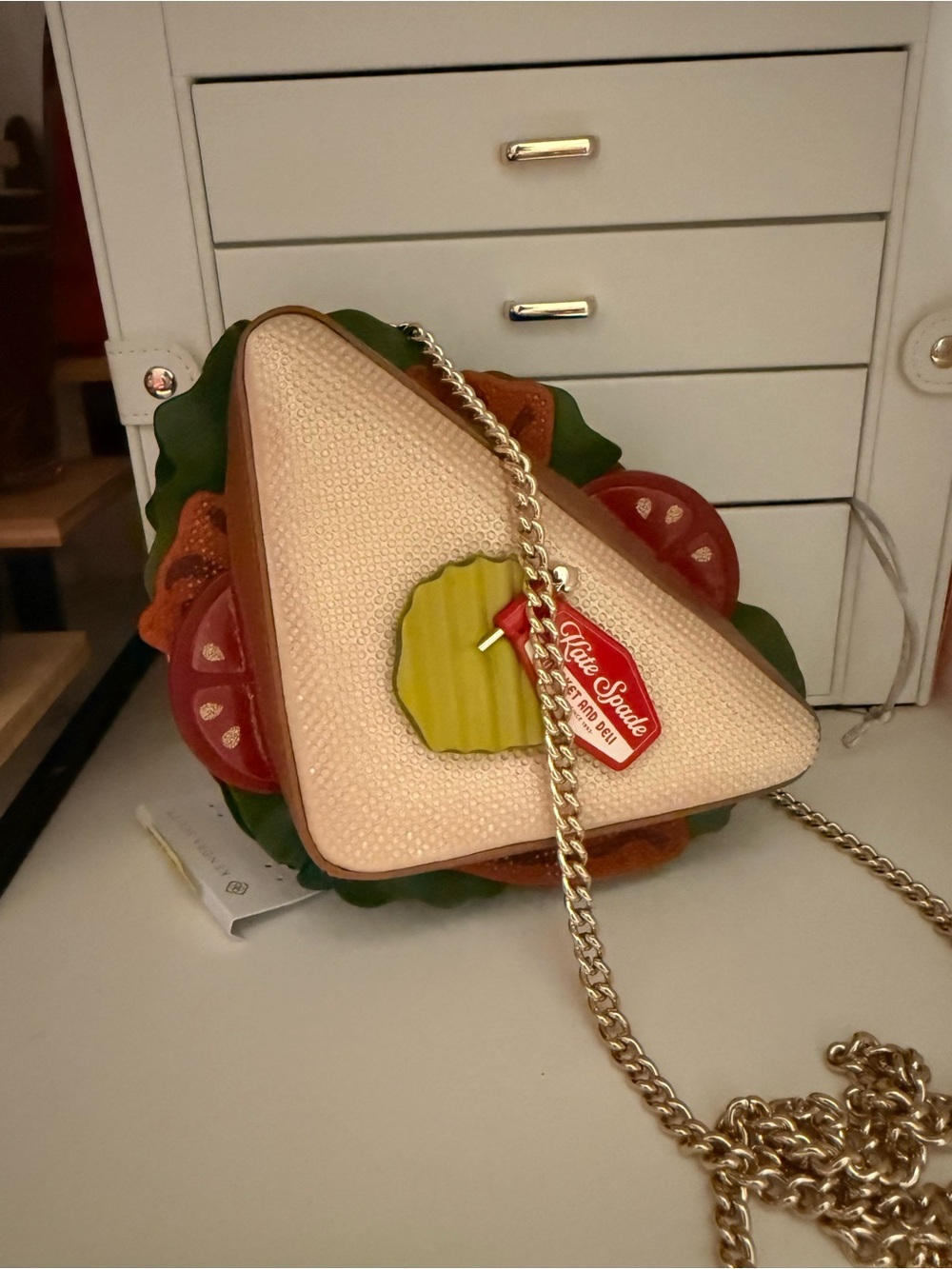 kate spade cream and pink sandwich-shaped crossbody with gold chain